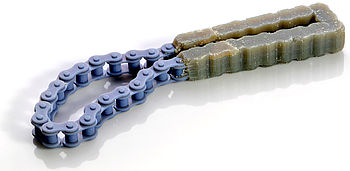 Link chain produced by additive manufacturing, requiring no further assembly